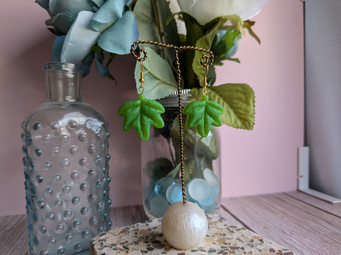 Flower and Winged Creature Earrings