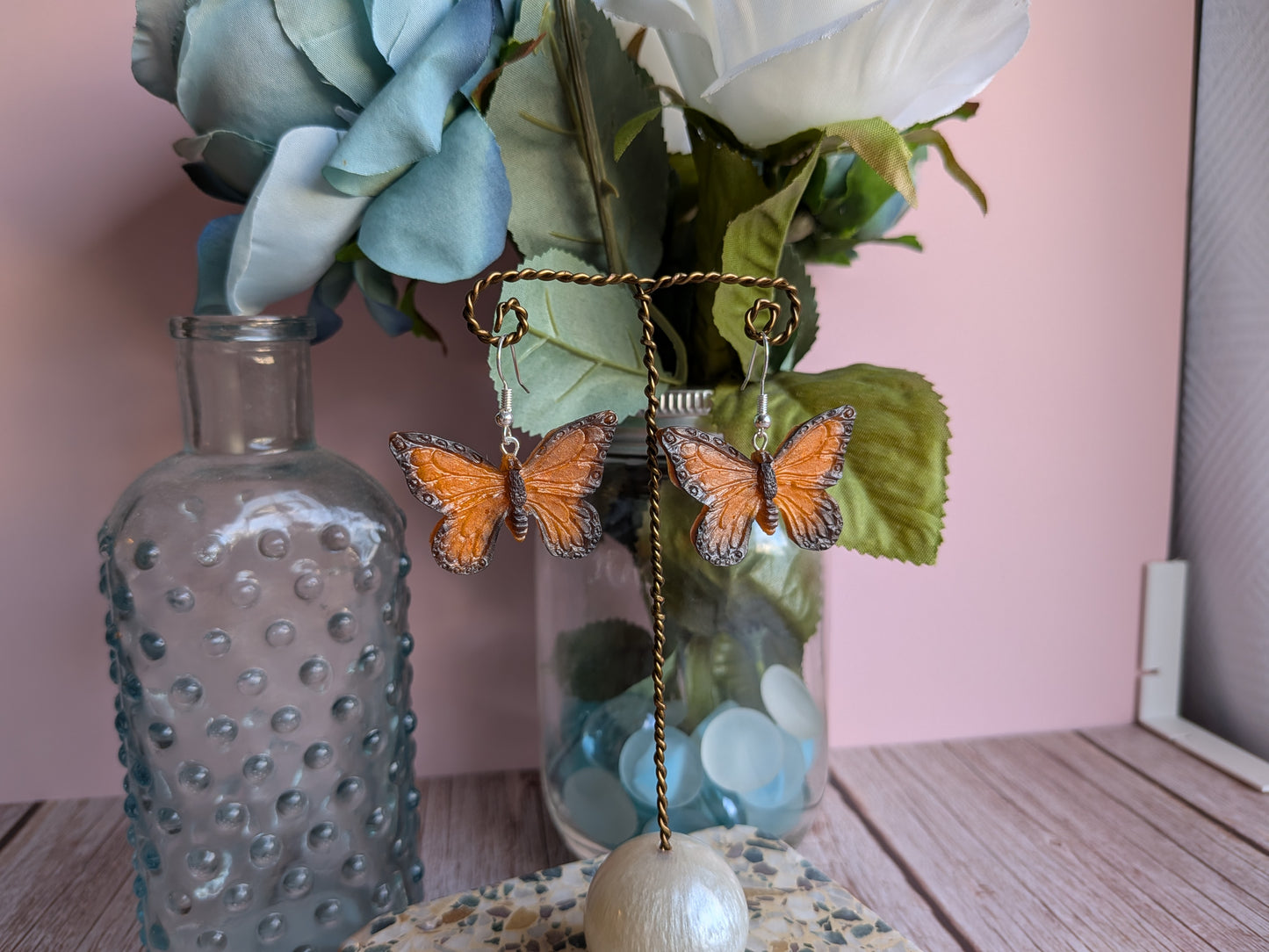 Flower and Winged Creature Earrings