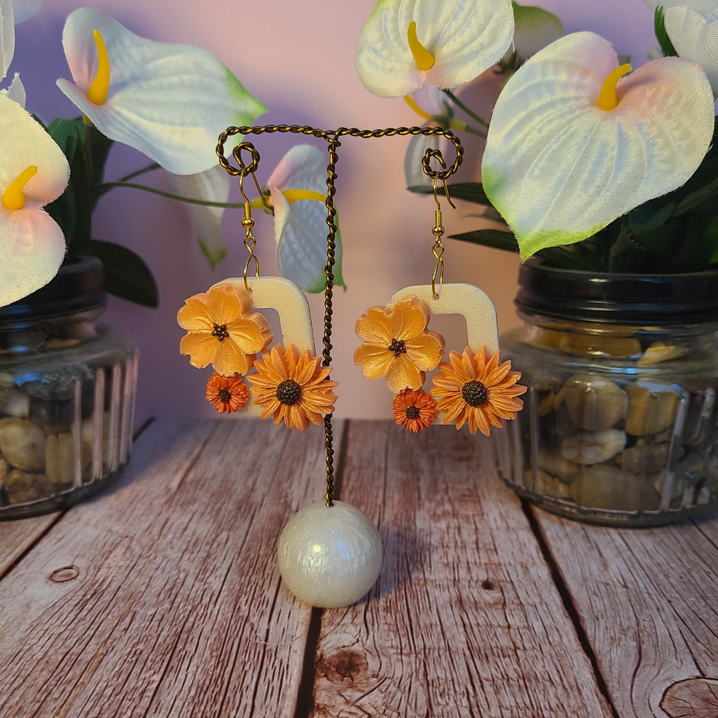 Flower and Winged Creature Earrings
