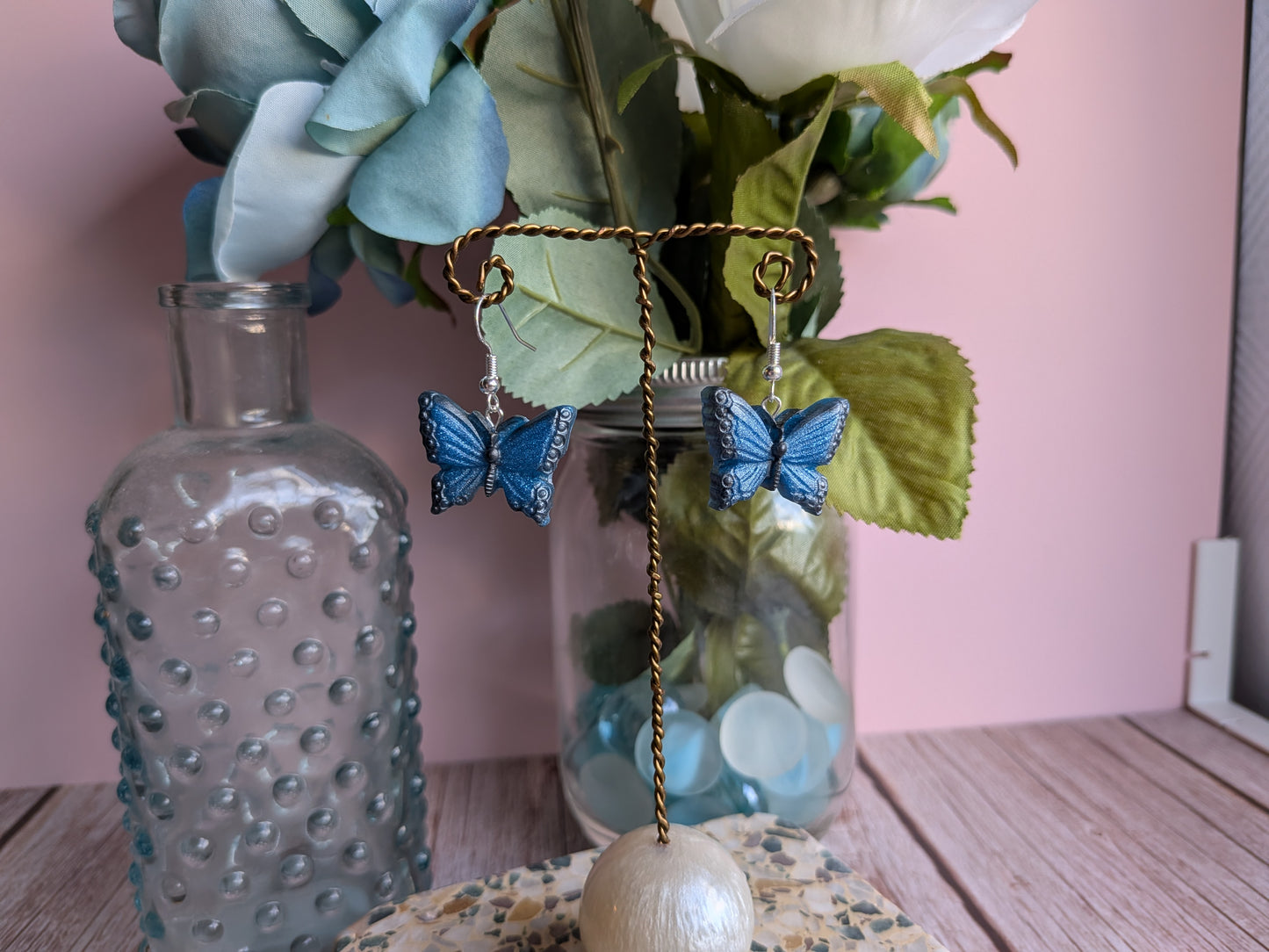 Flower and Winged Creature Earrings