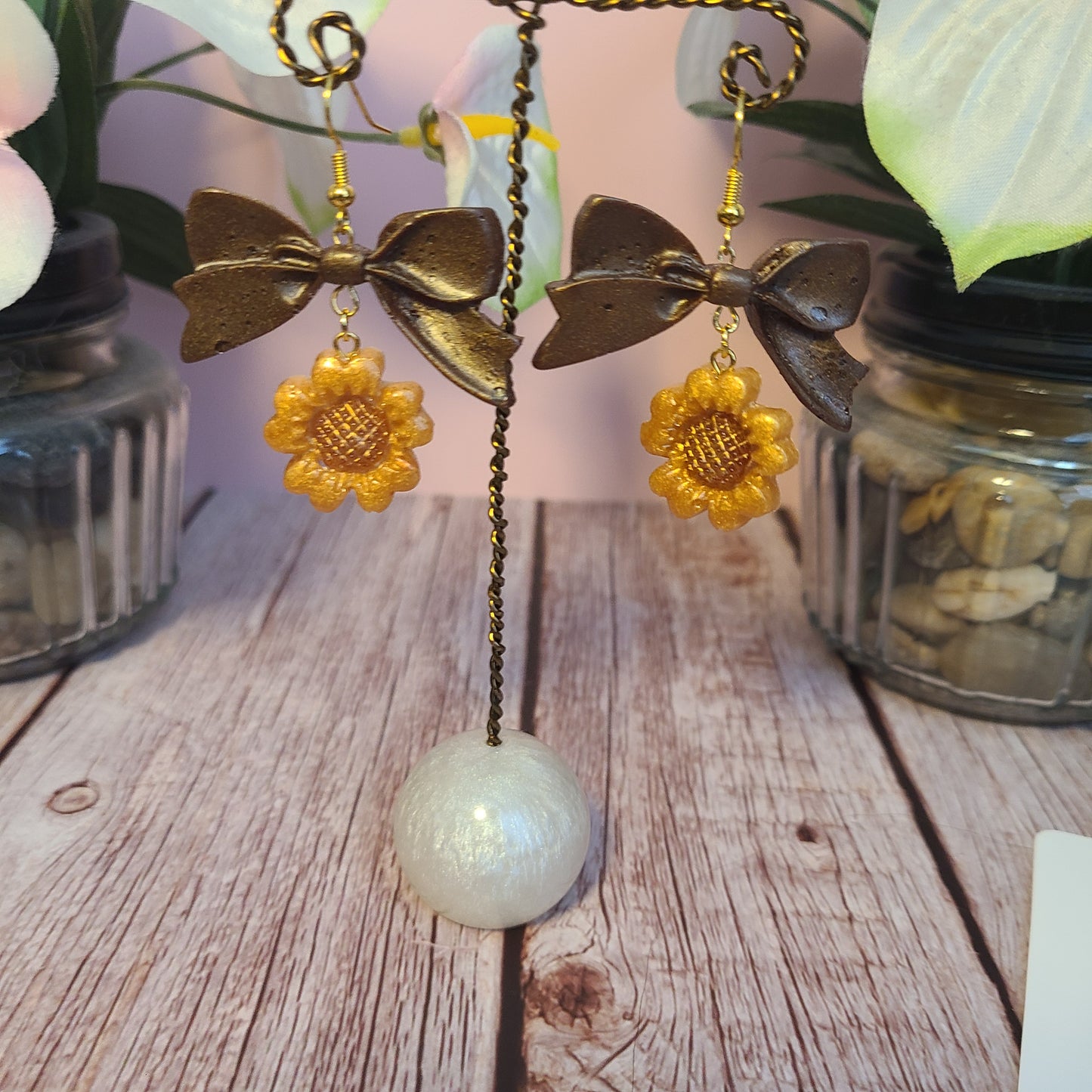 Flower and Winged Creature Earrings